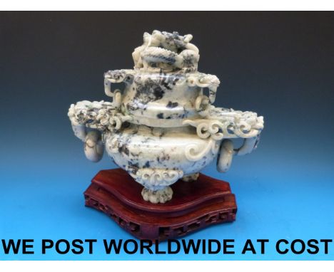 A Chinese large pale greyish-green jadeite tripod censer and cover carved with a coiled dragon finial, the stone with some da