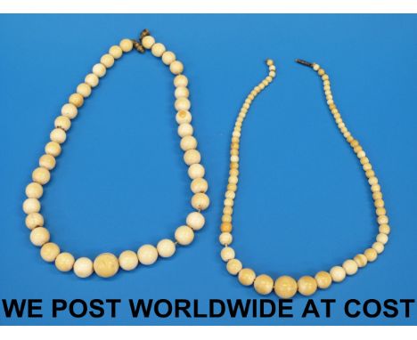 Two ivory necklaces the beads of graduating form.