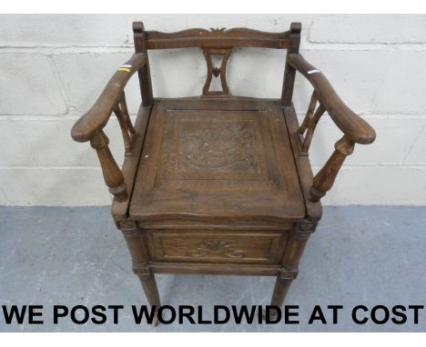 A carved oak commode (width 47cm, depth 45cm, height 86cm)