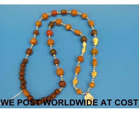 A Japanese prayer bead necklace of various beads including early plastic, seeds, ivory etc.
(57.5cm drop) 158g