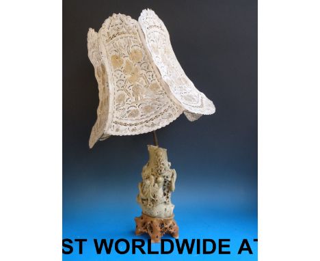 A large Chinese carved soapstone lamp