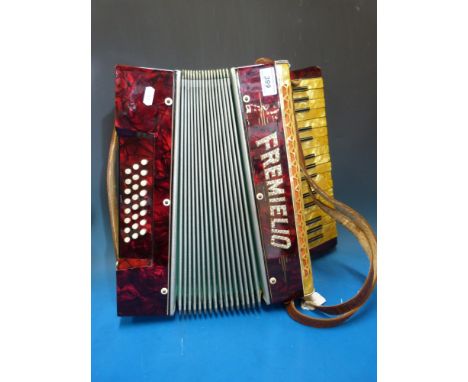 A 24 bass red pearloid Fremielio piano accordion in case