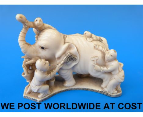 A 19thC Chinese ivory model of boys washing an elephant 