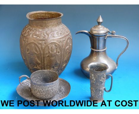 An Indian white metal cup and saucer together with a Chinese silver plated teapot, Persian jar and a white metal cup. 