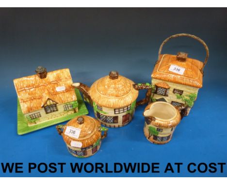 Beswick cottage ware, five pieces including cheese dish, biscuit barrel and tea service