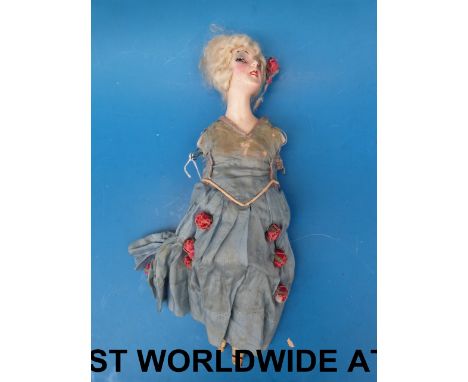 A continental doll with ceramic head and bust in period clothing (31cm tall) 