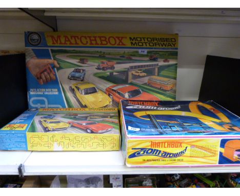 Three Matchbox diecast model vehicle sets M-2, E-2 and Zoom Around (all in original boxes) 