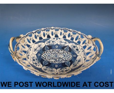 An early Worcester blue and white oval basket painted in underglaze blue with Bow tied lozenge mark to base