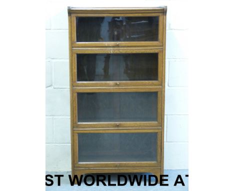 An oak Globe Wernicke style four-section bookcase by Kendrick & Jefferson (width 71cm, depth 30cm, height 134cm)