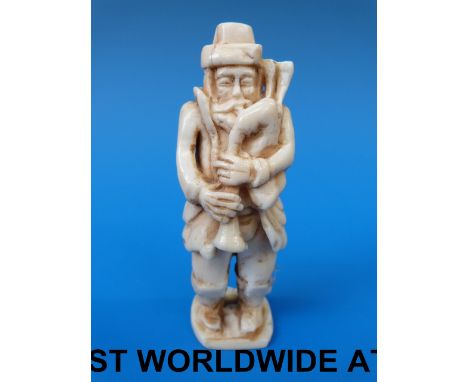 An European ivory figure of a bagpiper (9.5cm)