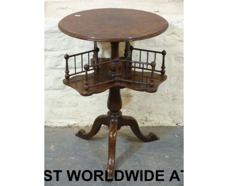 A Victorian burr walnut circular top book table by T H Filmer & Sons, London. The three-branch galleried book section revolve