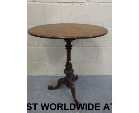 A late 19thC walnut inlaid oval occasional table with spiral decoration to central support and raised on tripod feet (maximum