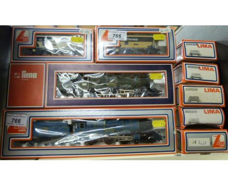Two Lima 00 gauge locomotives King George V 5103W and King Charles II 205104 MWG, together with seven wagons (all in original