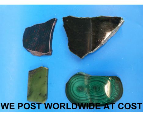 A collection of four large specimen stones including jade