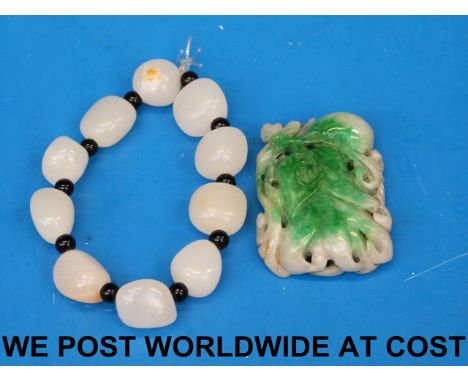 A jade bracelet and a jadeite pendant