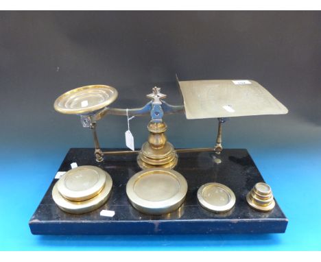 A large set of Victorian brass postal scales with weights
