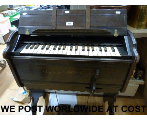 A late 19thC portable harmonium 