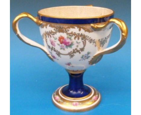 A Cauldon tyg hand decorated with enamel and gilt (18cm tall)