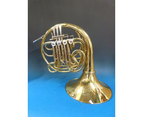 A French horn in F and Bb with rotary valves in carry case