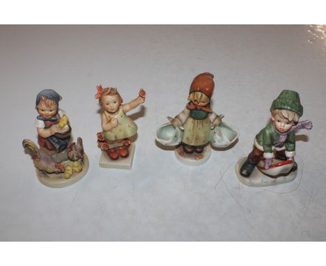 Three Goebel figures and one other similar 