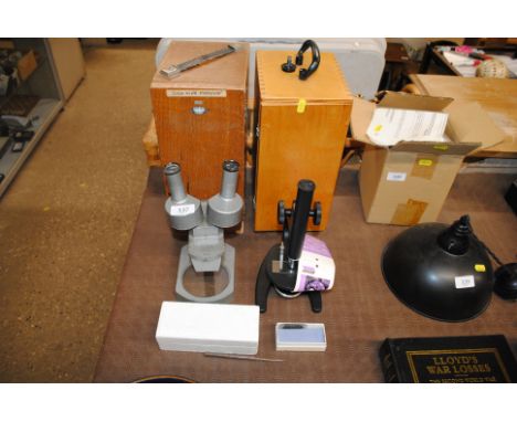 A Charles Perry binocular microscope 4889 and an Arrow microscope both with fitted cases and some slides 
