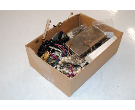 A box containing various costume jewellery including bead necklaces, stick pins etc.