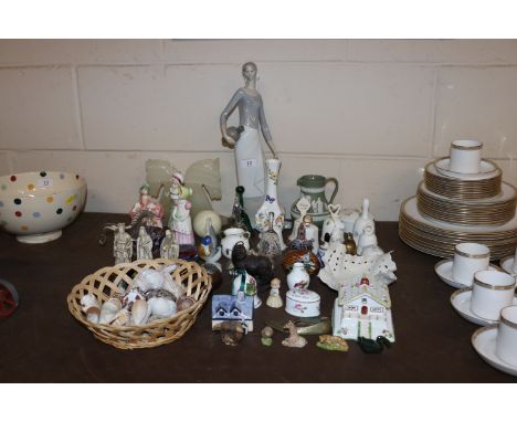 A quantity of ornamental bells, shells, pastel burner, book ends in the form of horses heads, Nao figure etc.