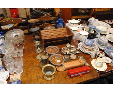 A wooden book trough and a pair of silver plated dwarf candlesticks, wine coasters, flatware, copper and brass kettle, brass 