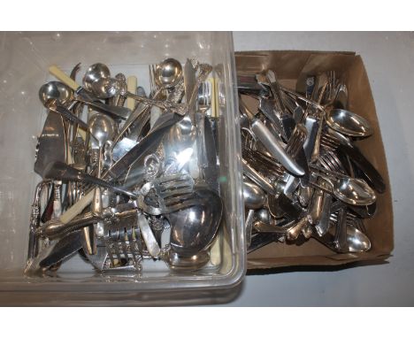 Two boxes containing a quantity of various silver plated ware to include a ladle, grape scissors, toasting fork etc.