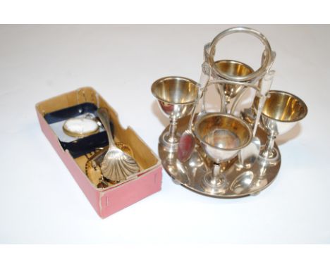 A silver plated four piece egg cruet; a caddy spoon; two ladies wrist watches; a cameo brooch and an amber set brooch