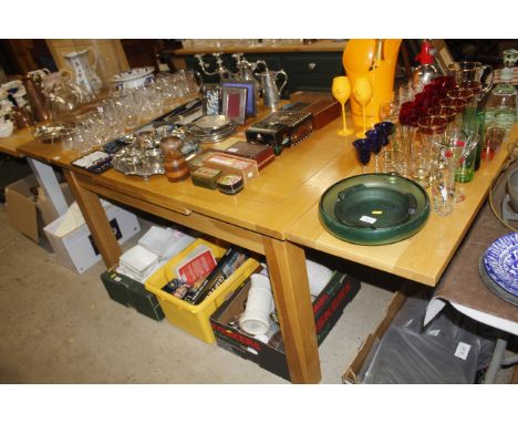 A modern light oak draw leaf dining table 