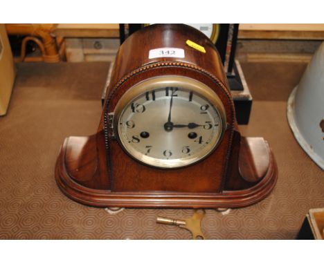 A 19th Century mahogany cased mantel clock with eight day movement with key and pendulum
