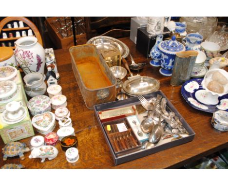 A quantity of various silver plated flatware; and a copper planter decorated with lion mask decoration