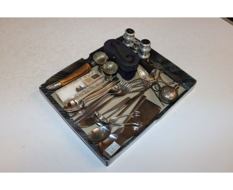 A box containing white metal toddy ladle, a pair of silver sugar tongs, stainless steel cutlery, a pair of silver plated salt