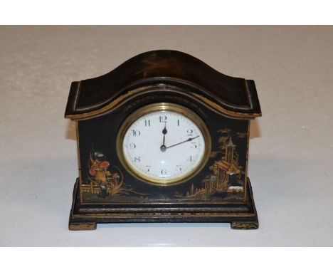 A black lacquered chinoiserie decorated mantel clock 