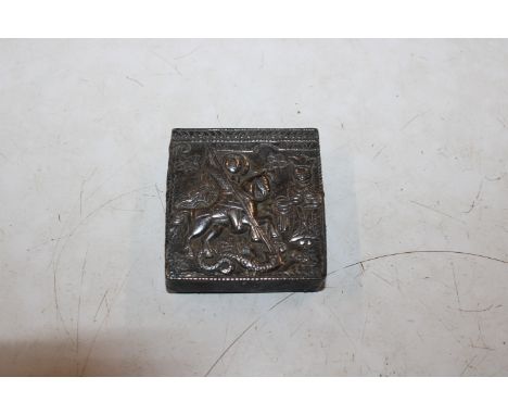 A vintage metal box with repousse decoration depicting George and The Dragon 