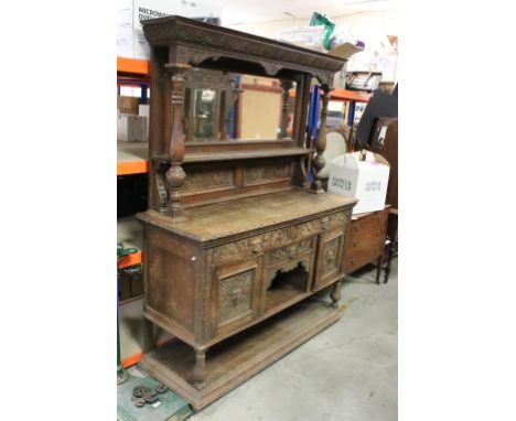 Victorian Oak Mirrored Back Sideboard, the arrangement of three drawers and two cupboard doors carved with green man handles 