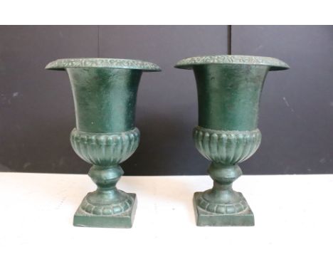 Pair of cast iron urn planters of classic form, approx 34cm high 