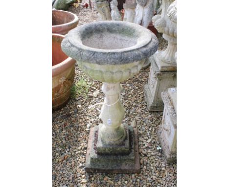 Reconstituted stone garden urn, the bowl of shallow form, raised on a baluster column base. (Measures approx 97cm high) 