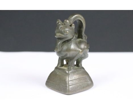 An antique bronze Burmese opium weight, stands approx 73mm in height. 