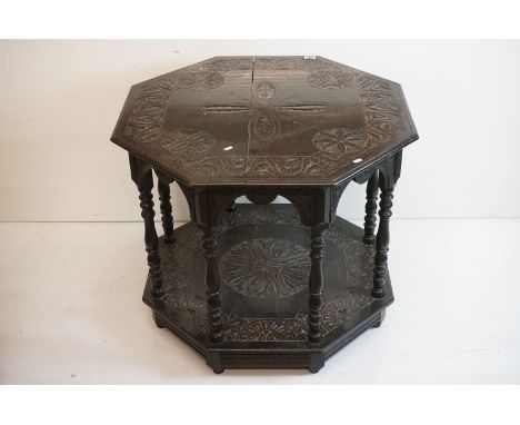 Victorian Dark Oak Octagonal Centre Table in the 17th century manner with carved decoration, raised on eight turned legs and 