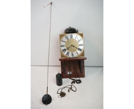 18th Century style brass bracket clock, the square dial applied with brass mounts, silvered chapter ring and Arabic numerals,