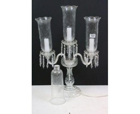 Moulded clear glass three-branch electric candelabrum table lamp, with etched hurricane glass shades and crystal lustre drops