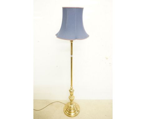 Brass Standard Lamp raised on a circular stepped base, with blue shade, total height 178cm 