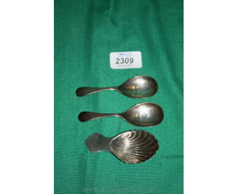 A pair of Silver caddy Spoons, Birmingham 1964 and a shell shaped caddy Spoon, Sheffield 1938.