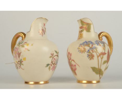 Two Royal Worcester blush ivory jugs, each with floral decoration and gilt handles, shape number 1094, height 13cm.    Condit