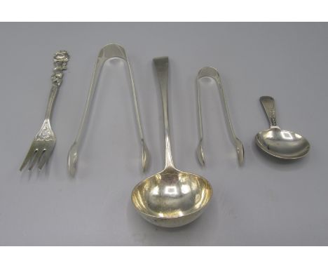 A George III engraved caddy spoon, London 1801, together with a George III Old English pattern sauce ladle and four other pie