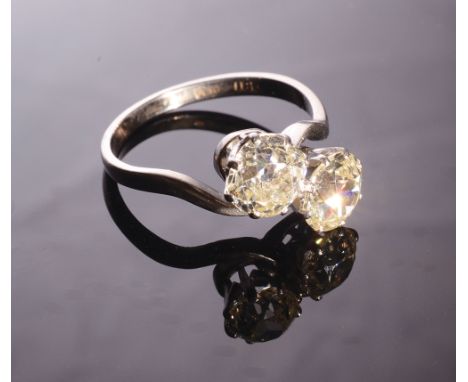 A good diamond crossover ring, together they total 2.06 carats, colour L, clarity VS. 