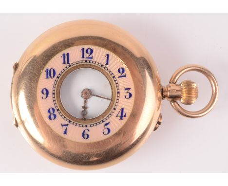 A 14ct gold keyless half hunter cased fob watch with a blue and pink enamelled chapter ring.   Condition report:  35mm not in