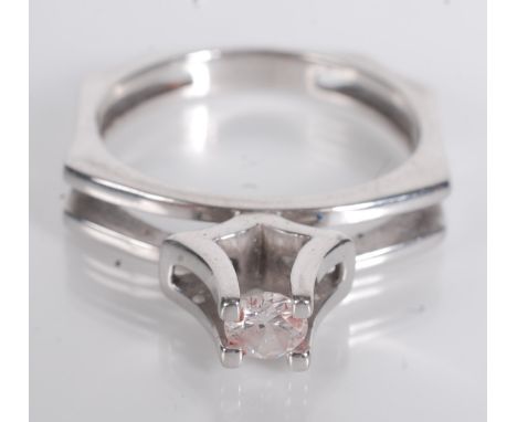 An 18ct white gold contemporary diamond solitaire ring.